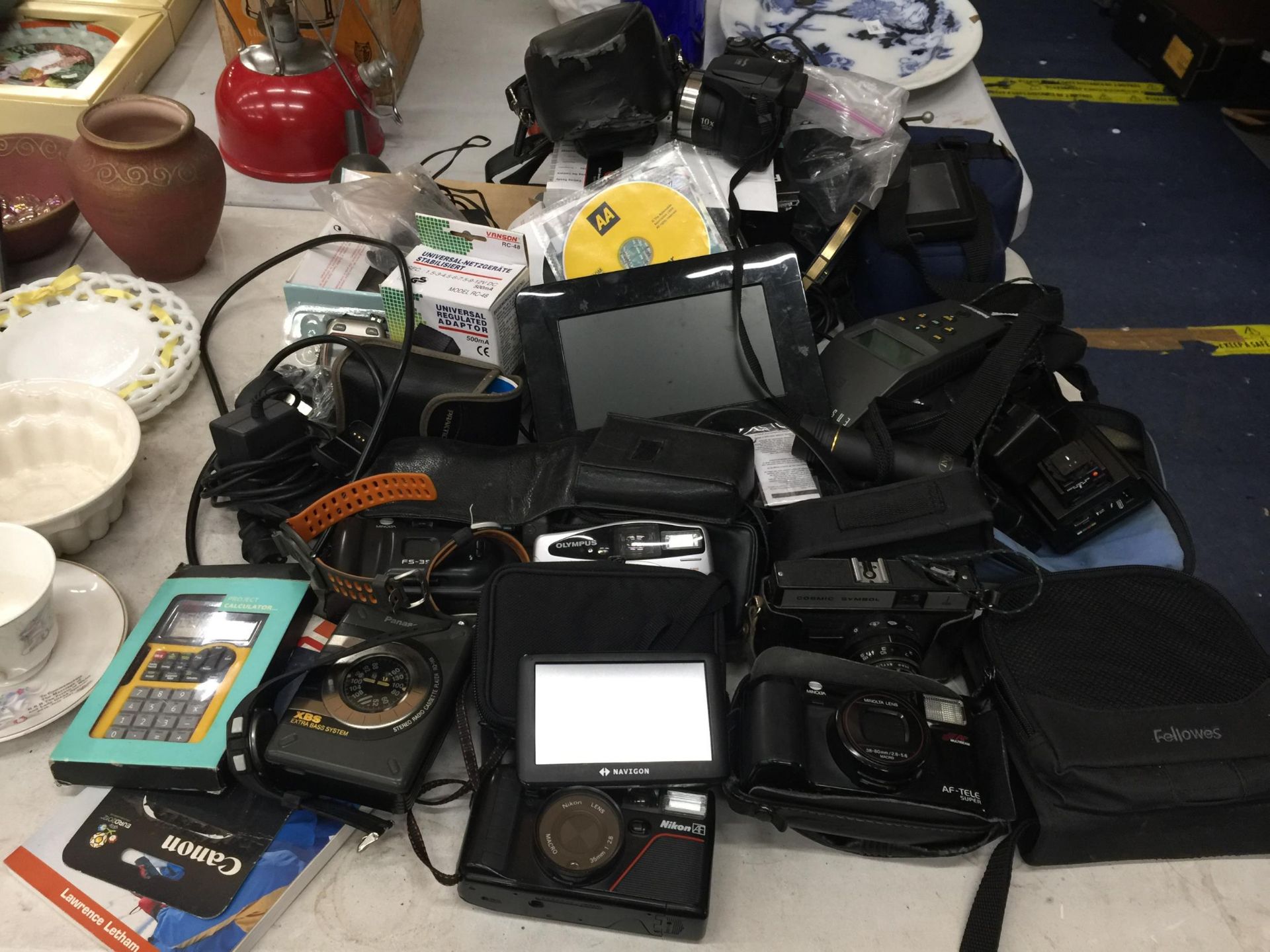 A LARGE COLLECTION OF CAMERAS TO INCLUDE COSMIC SYMBOL, FUJIFILM S5800, NIKON ETC