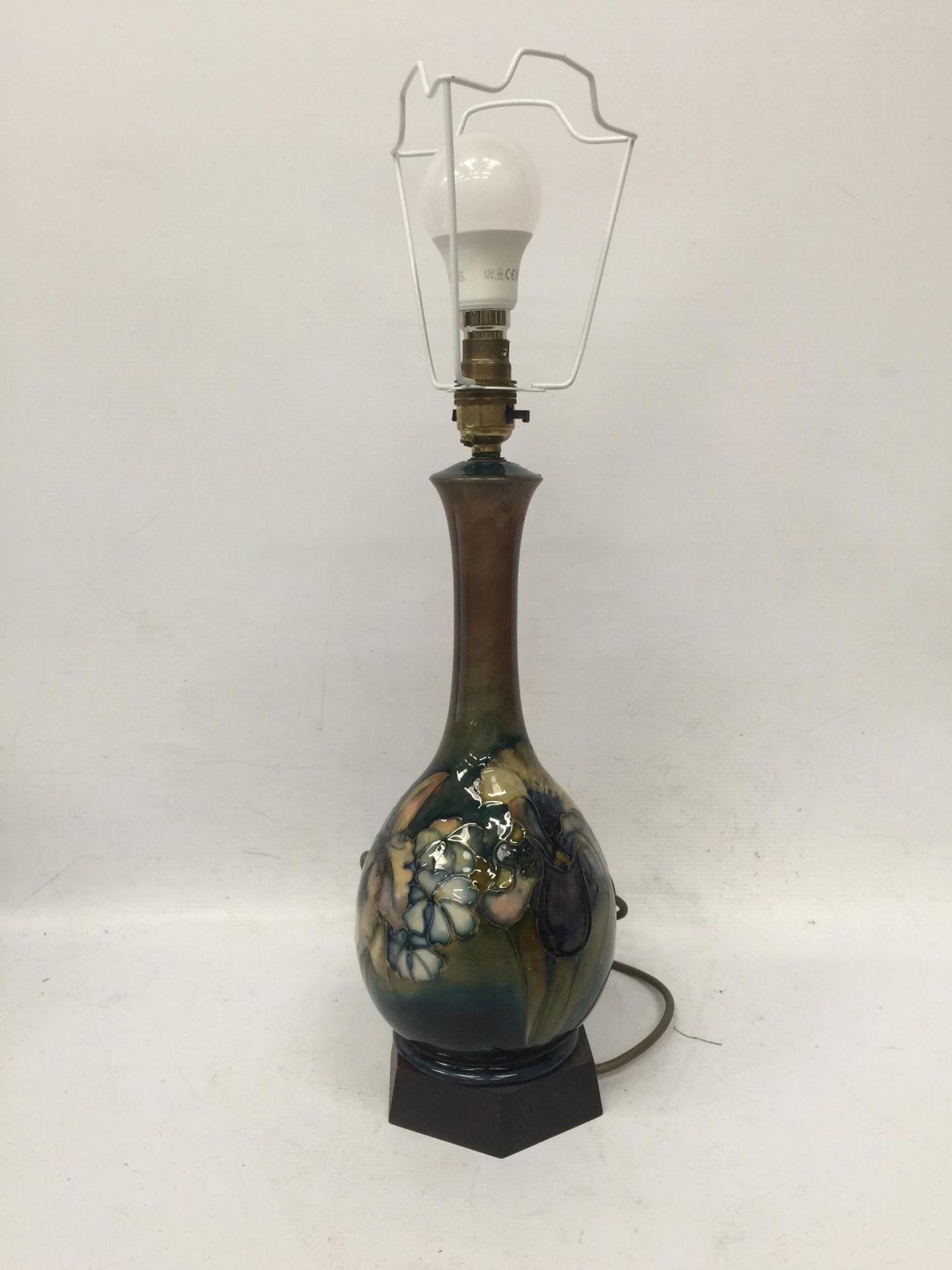A WALTER MOORCROFT FLORAL BOTTLE SHAPED TABLE LAMP