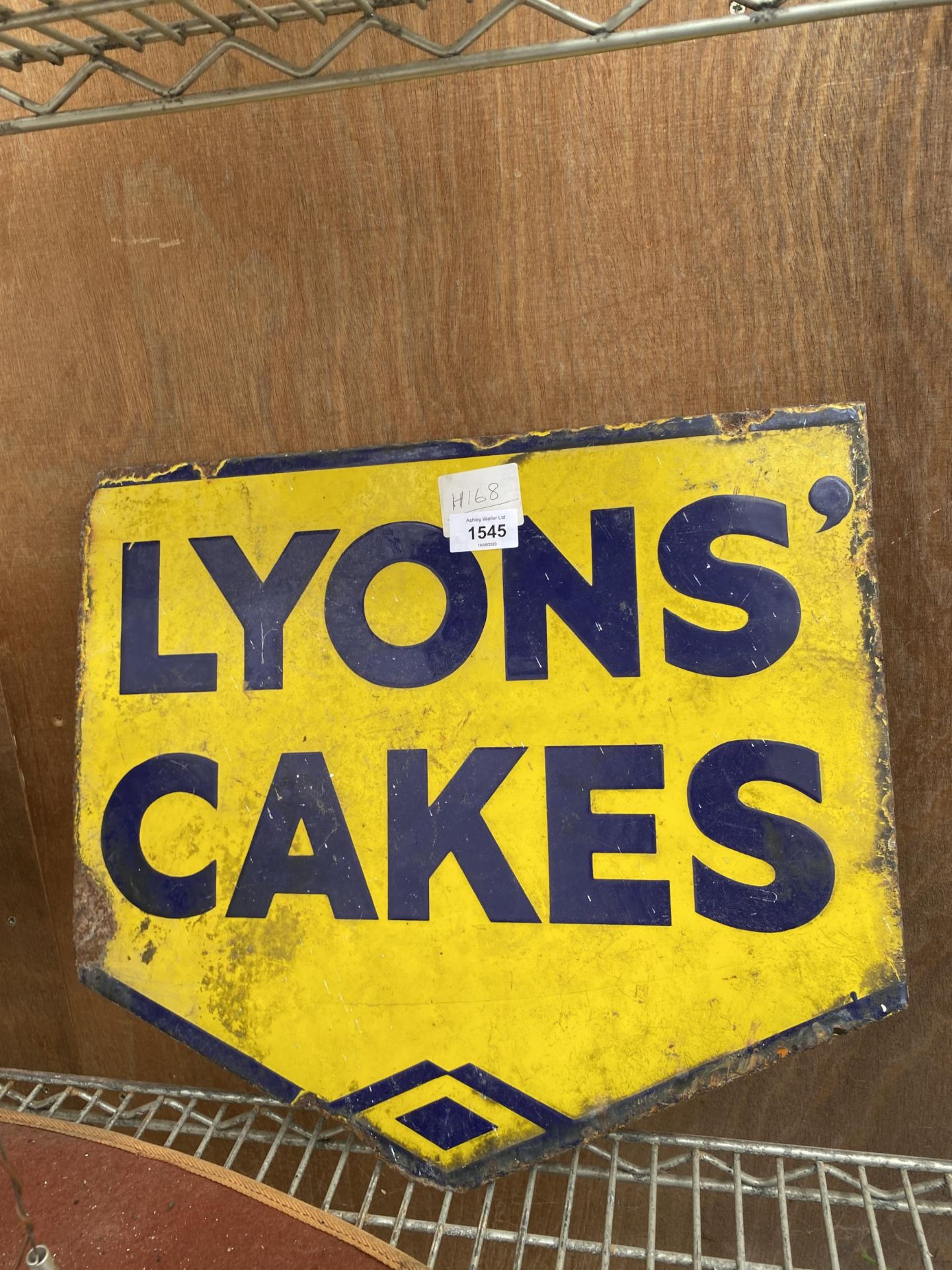 A VINTAGE DOUBLE SIDED ENAMEL LYONS CAKES SIGN, LENGTH 44CM