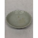 A CHINESE CELADON DISH WITH BIRD & FLORAL DESIGN UNMARKED TO BASE, DIAMETER 11.5CM