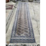 A GREY PATTERNED FRINGED HALL RUNNER