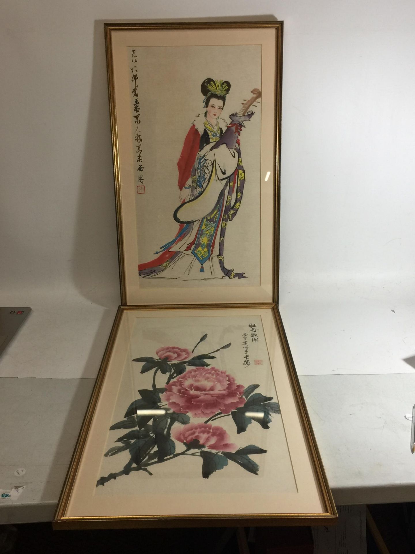 A PAIR OF ORIENTAL FRAMED PRINTS - FLOWER AND LADY
