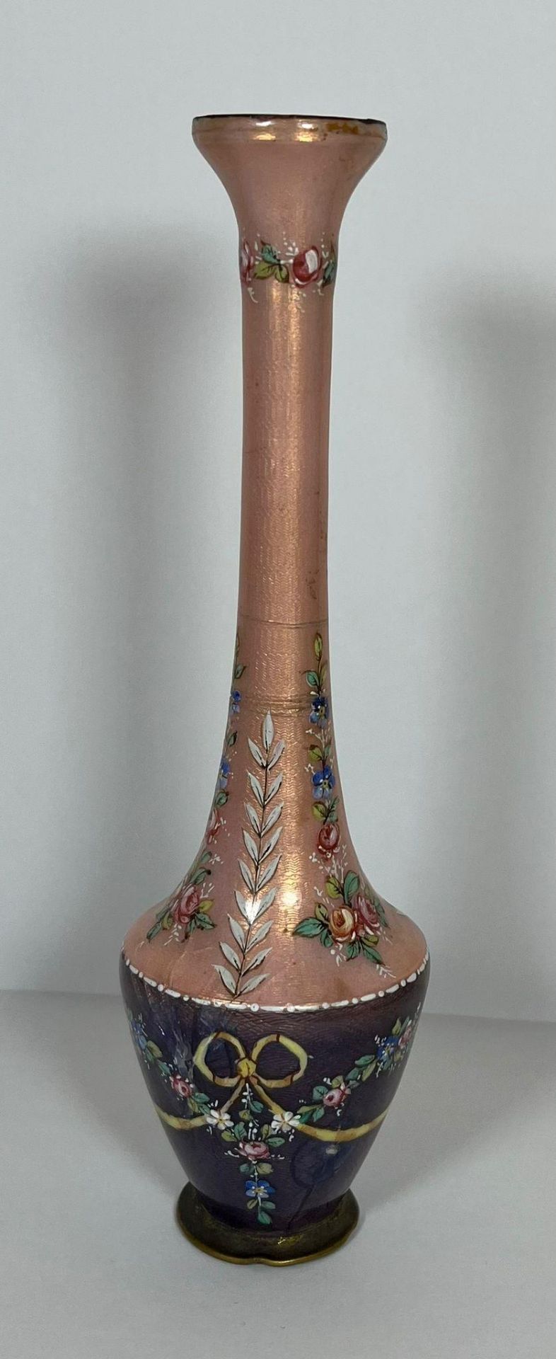 AN ANTIQUE EUROPEAN PINK & PURPLE ENAMEL DESIGN VASE DECORATED WITH FLORAL SWAG DESIGN, HEIGHT 15.