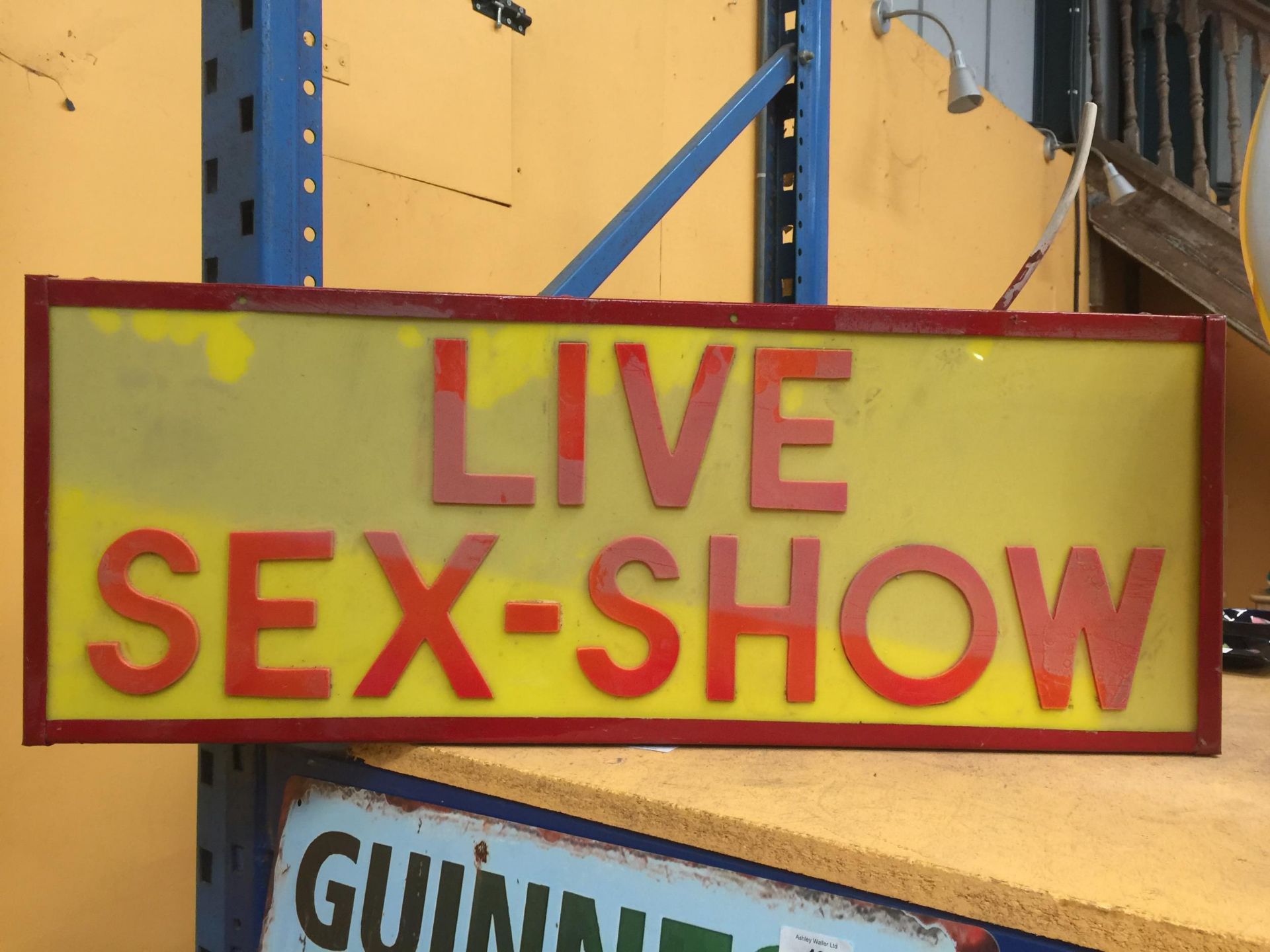 A 'LIVE SEX SHOW' ILLUMINATED BOX SIGN
