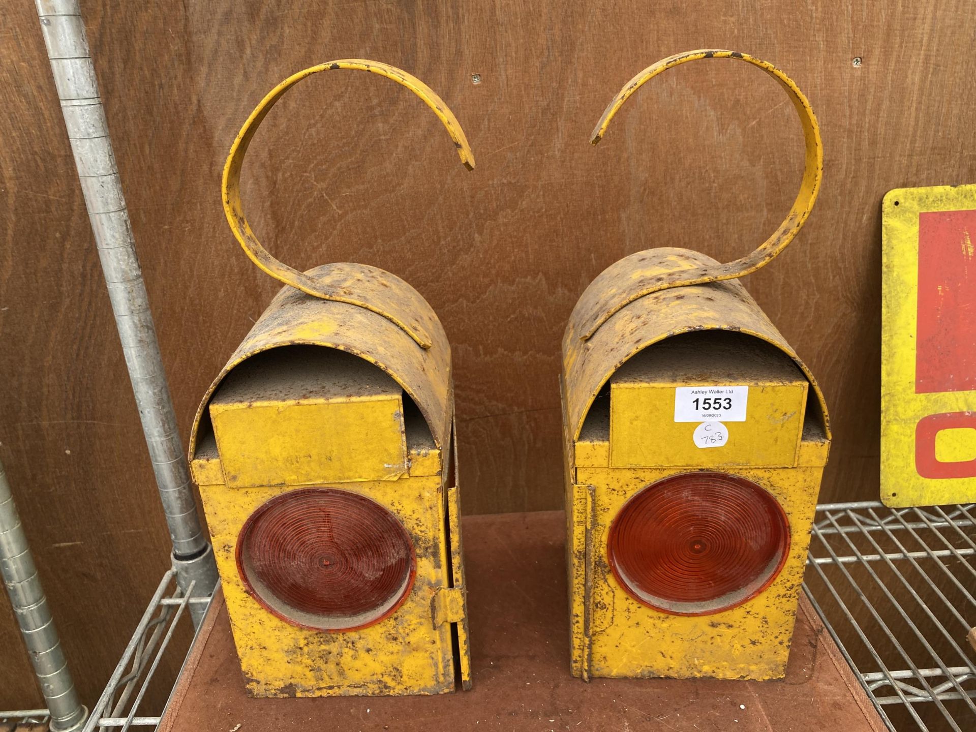 A PAIR OF VINTAGE YELLOW METAL RAILWAY/ROADWORKS LANTERNS