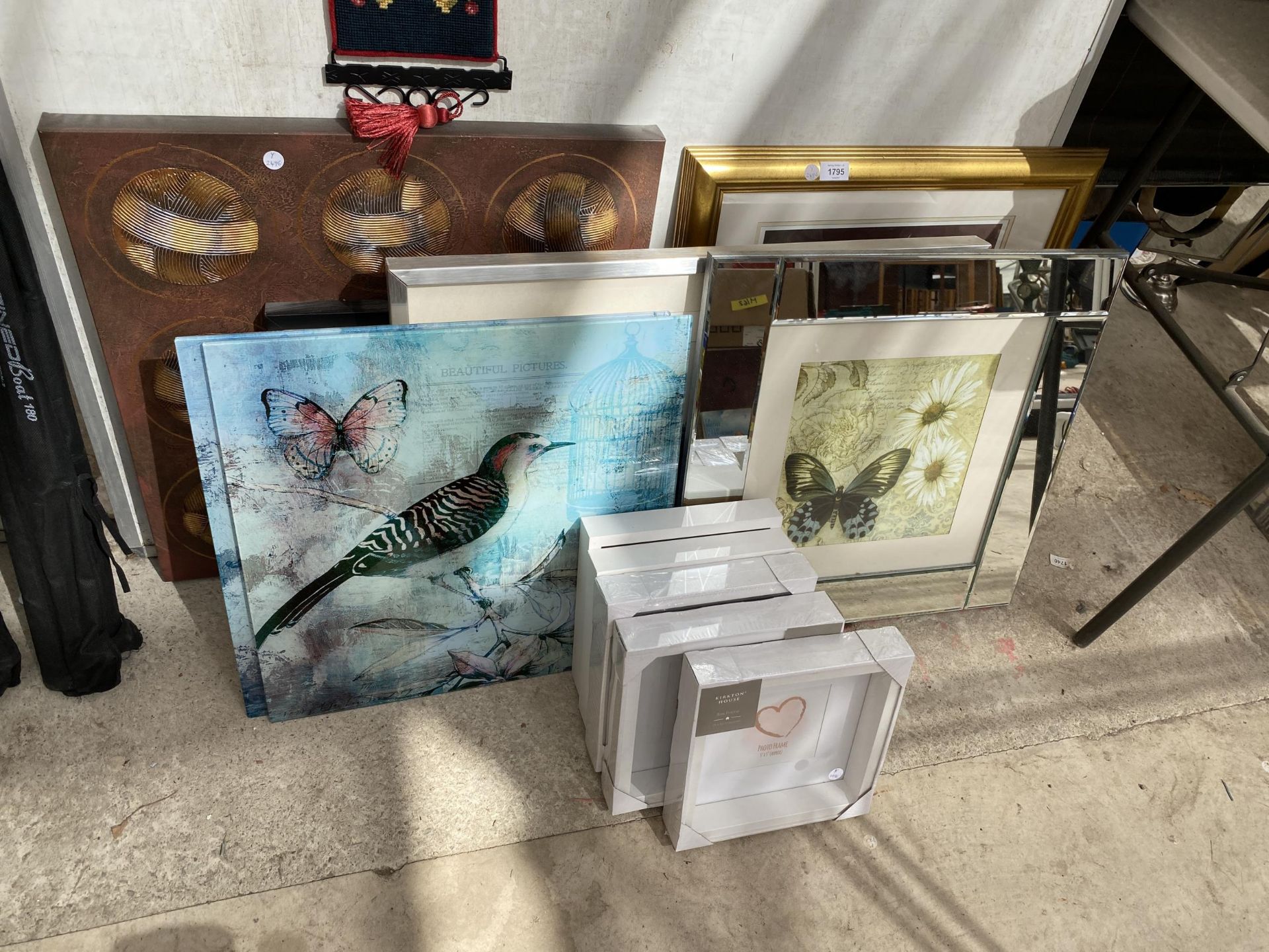 A COLLECTION OF MODERN PRINTS AND NEW PHOTO FRAMES