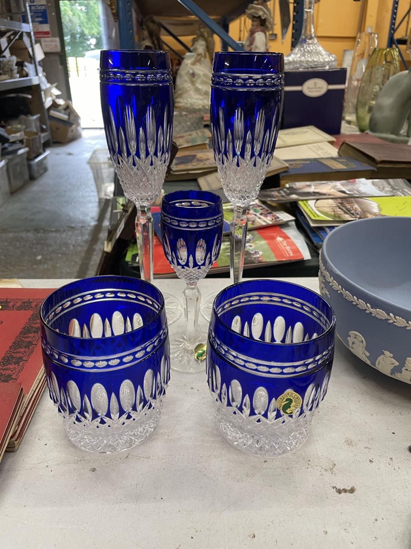 FIVE WATERFORD CLARENDON COBALT GLASSES TO INCLUDE TWO WHISKY, TWO CHAMPAGNE FLUTES AND A SHERRY