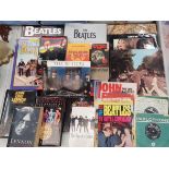 A COLLECTION OF BEATLES BOOKS AND RECORDS TO INCLUDE ABBEY ROAD, LET IT BE, SINGLES, ETC