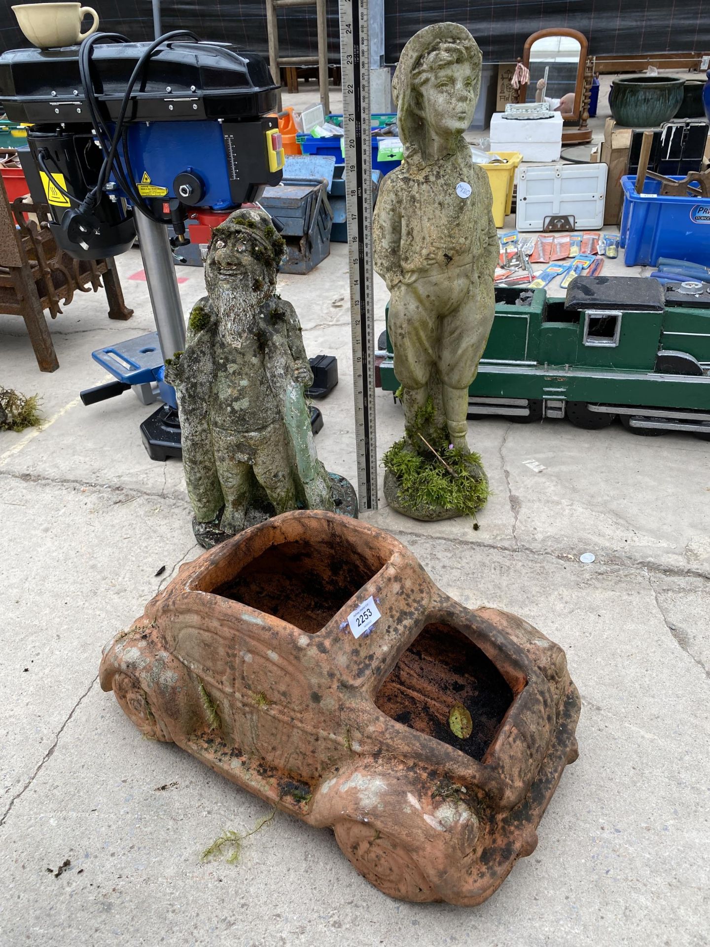 THREE CONCRETE GARDEN ORNAMENTS, TWO OF MALES AND ONE OF A VW