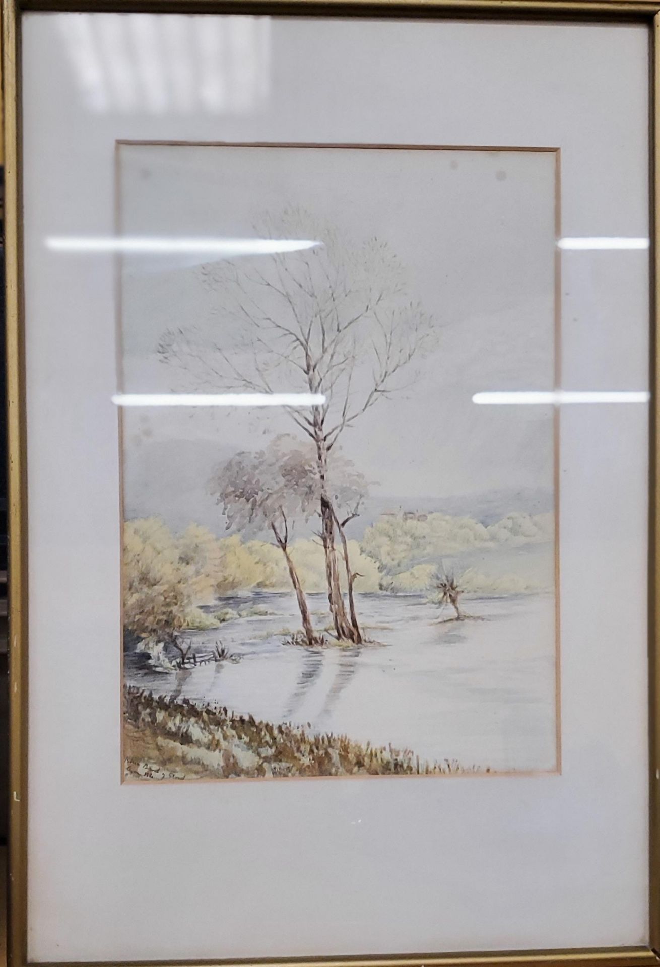 A SIGNED WATERCOLOUR OF THE FLOODED PASTURES