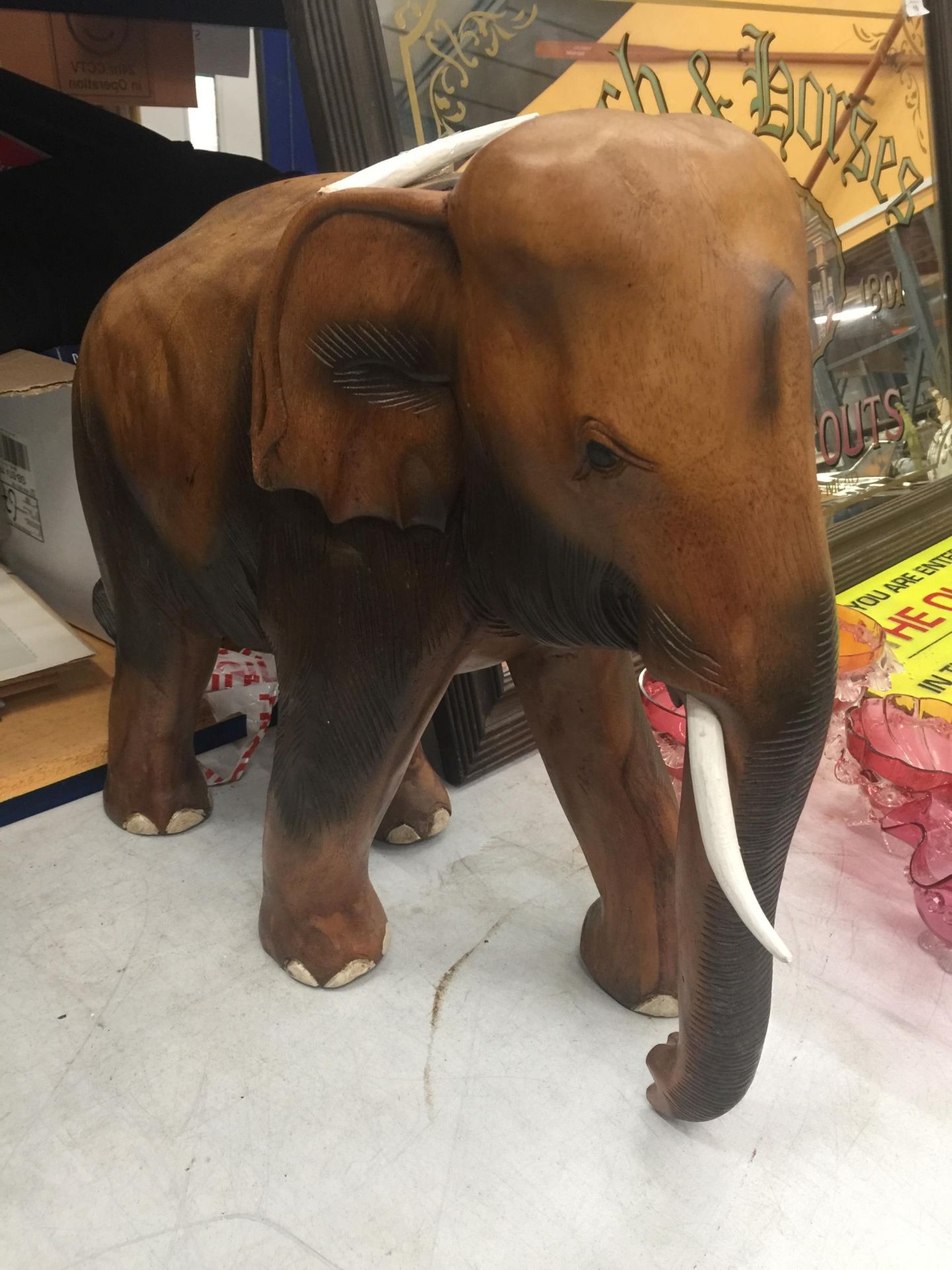 A LARGE HEAVY WOODEN TRIBAL ELEPHANT ANIMAL FIGURE