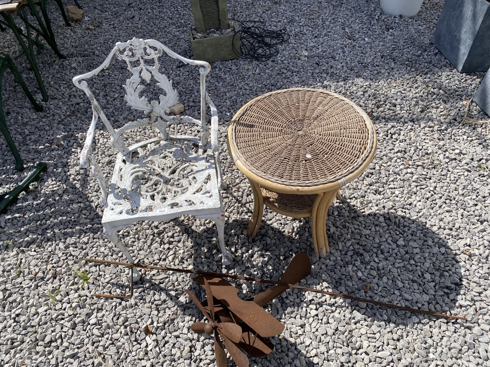 THREE GARDEN ITEMS TO INCLUDE A BISTRO CHAIR, CIRCULAR WICKER SIDE TABLE AND STEEL AEROPLANE