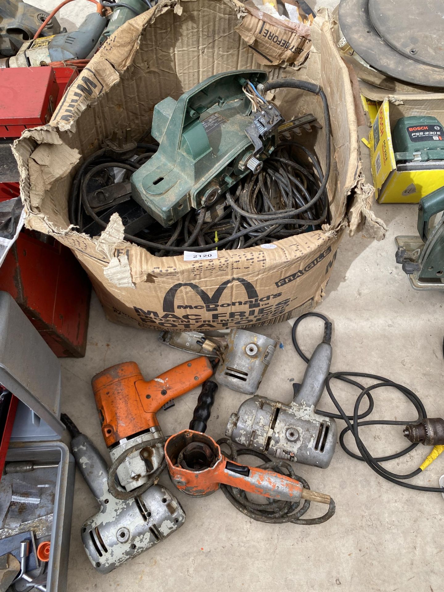 A BOX OF POWER TOOL PARTS FOR SPARES AND REPAIR