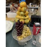 A VINTAGE BOWL OF CERAMIC FRUIT, A GLASS FOOTED BOWL AND THREE BUNCHES OF GLASS GRAPES