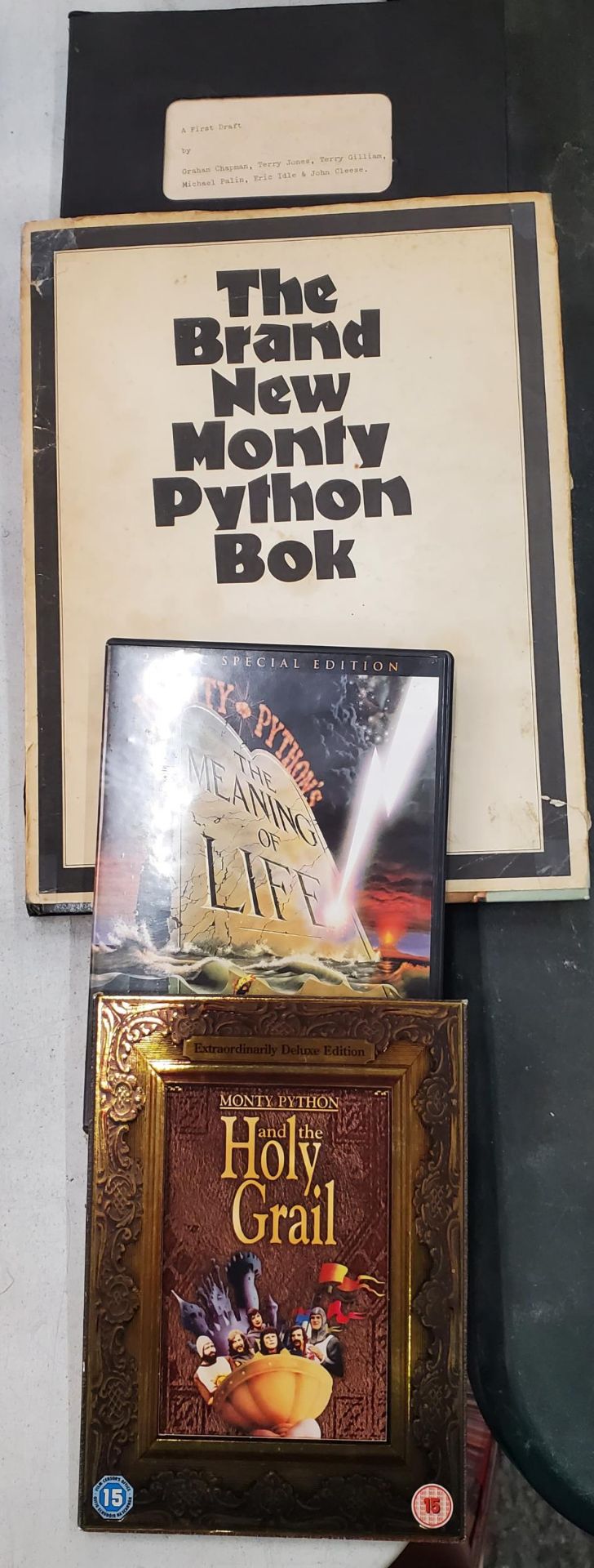 TWO VINTAGE MONTY PYTHON BOOKS AND TWO DVDS