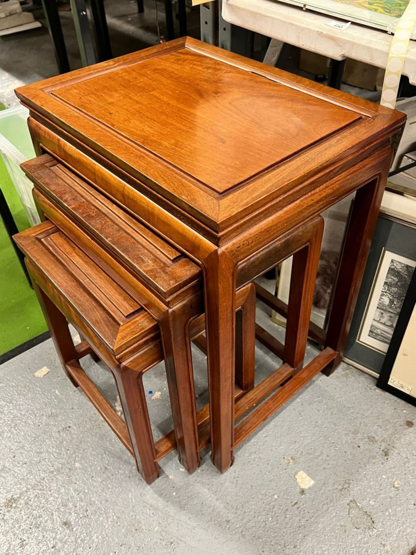 A VINTAGE NEST OF THREE ORIENTAL YEW WOOD TABLES - Image 3 of 3