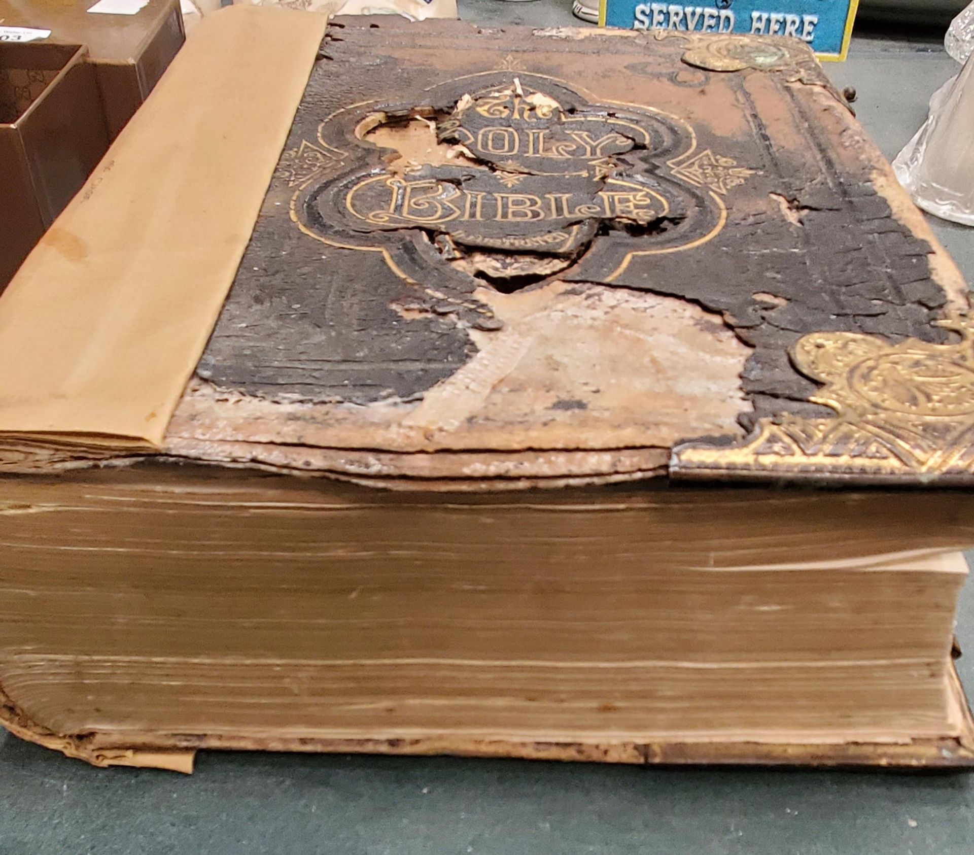 A LARGE ANTIQUARIAN HOLY BIBLE WITH COLOUR AND BLACK AND WHITE PLATES, SOME DAMAGE TO THE COVER - Image 2 of 3