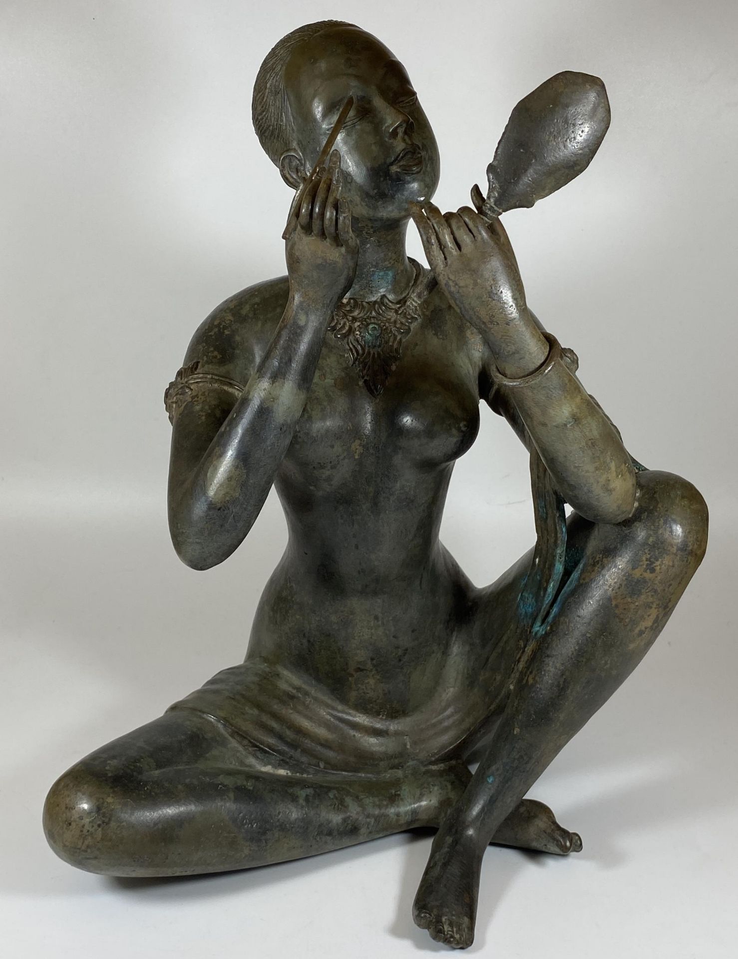 A LARGE HEAVY BRONZE MODEL OF A LADY HOLDING A MIRROR, HEIGHT 41CM