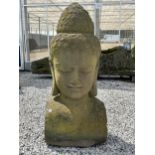 A LARGE RECONSTITUTED STONE BUDDHIST DIETY FIGURE - HEIGHT 150 CM, DEPTH 50 CM