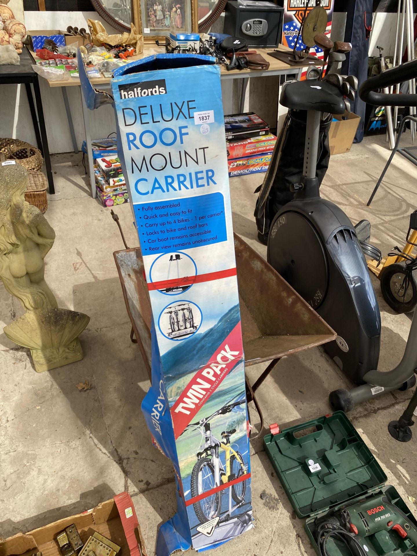 A BOXED HALFORDS DELUXE ROOF MOUNT CARRIER BIKE RACK