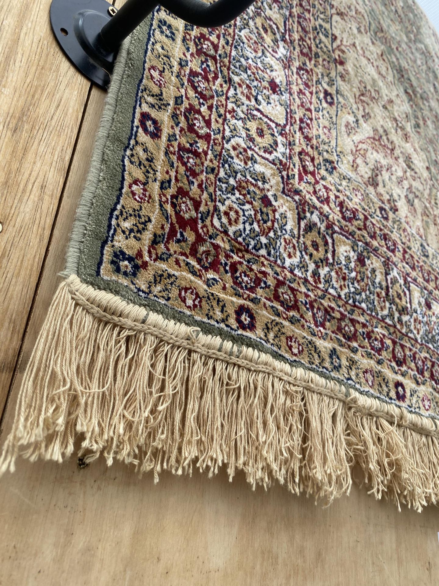 A MULTI COULOURED PATTERNED FRINGED RUG - Image 2 of 3