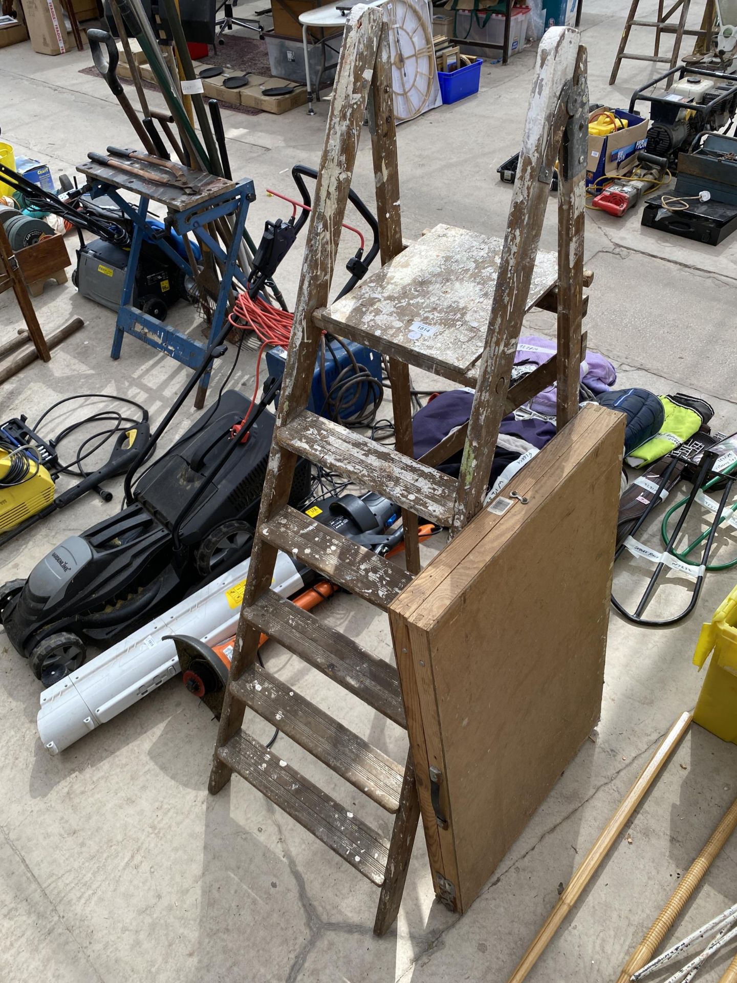 A SET OF STEP LADDERS AND PASTE TABLE