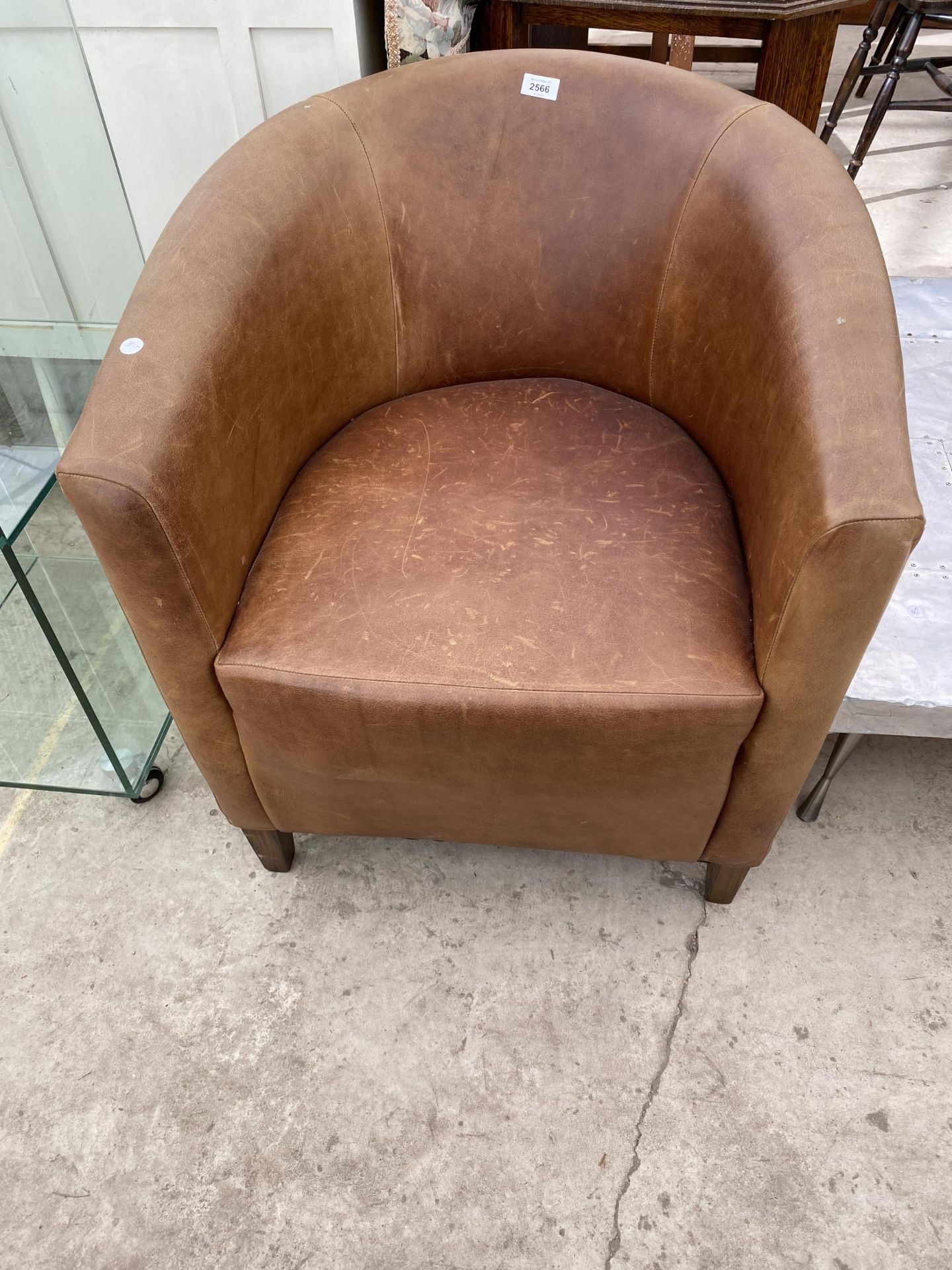 A VINTAGE CONTRACTS LEATHER TUB CHAIR