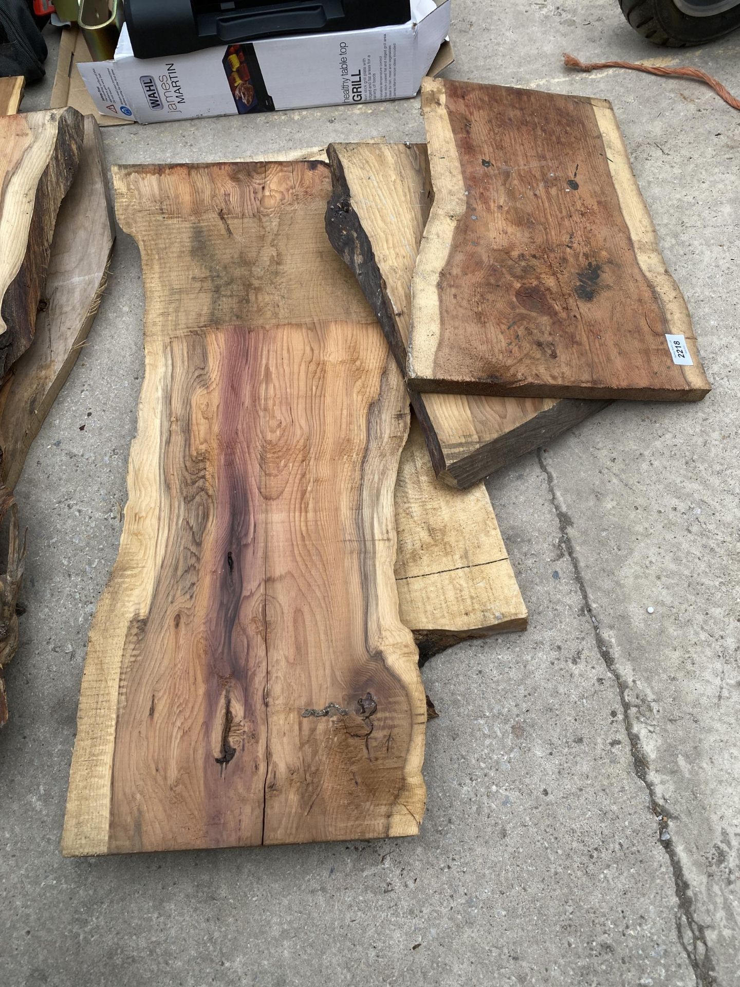 FOUR SMALL PIECES OF ROUGH SAWN YEW WOOD
