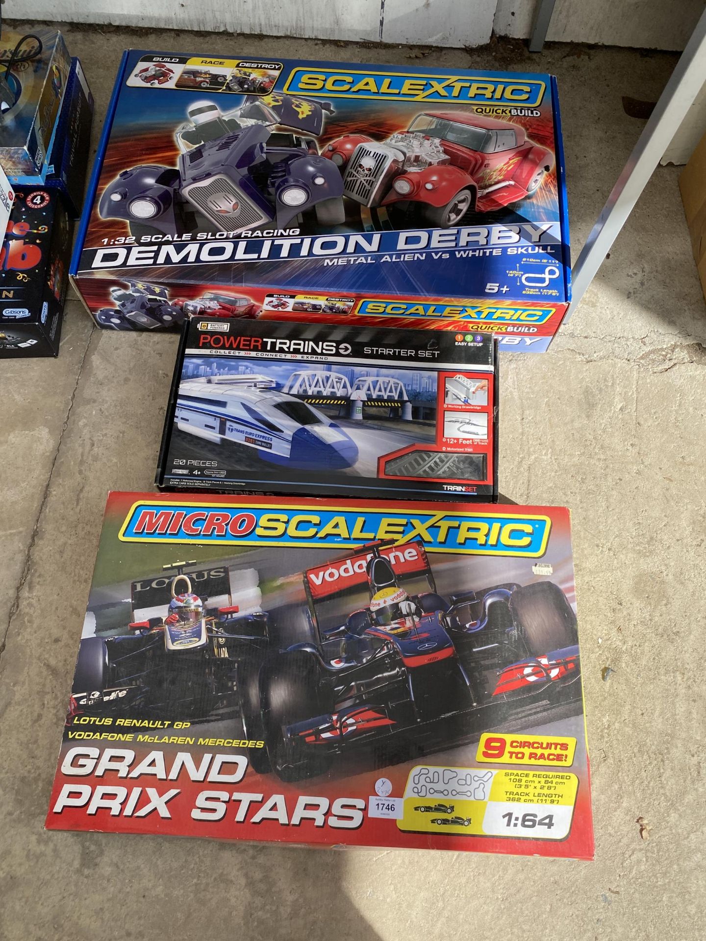 A GROUP OF THREE BOXED TOY ITEMS- SCALEXTRIC DEMOLITION DERBY & GRAND PRIX STARS