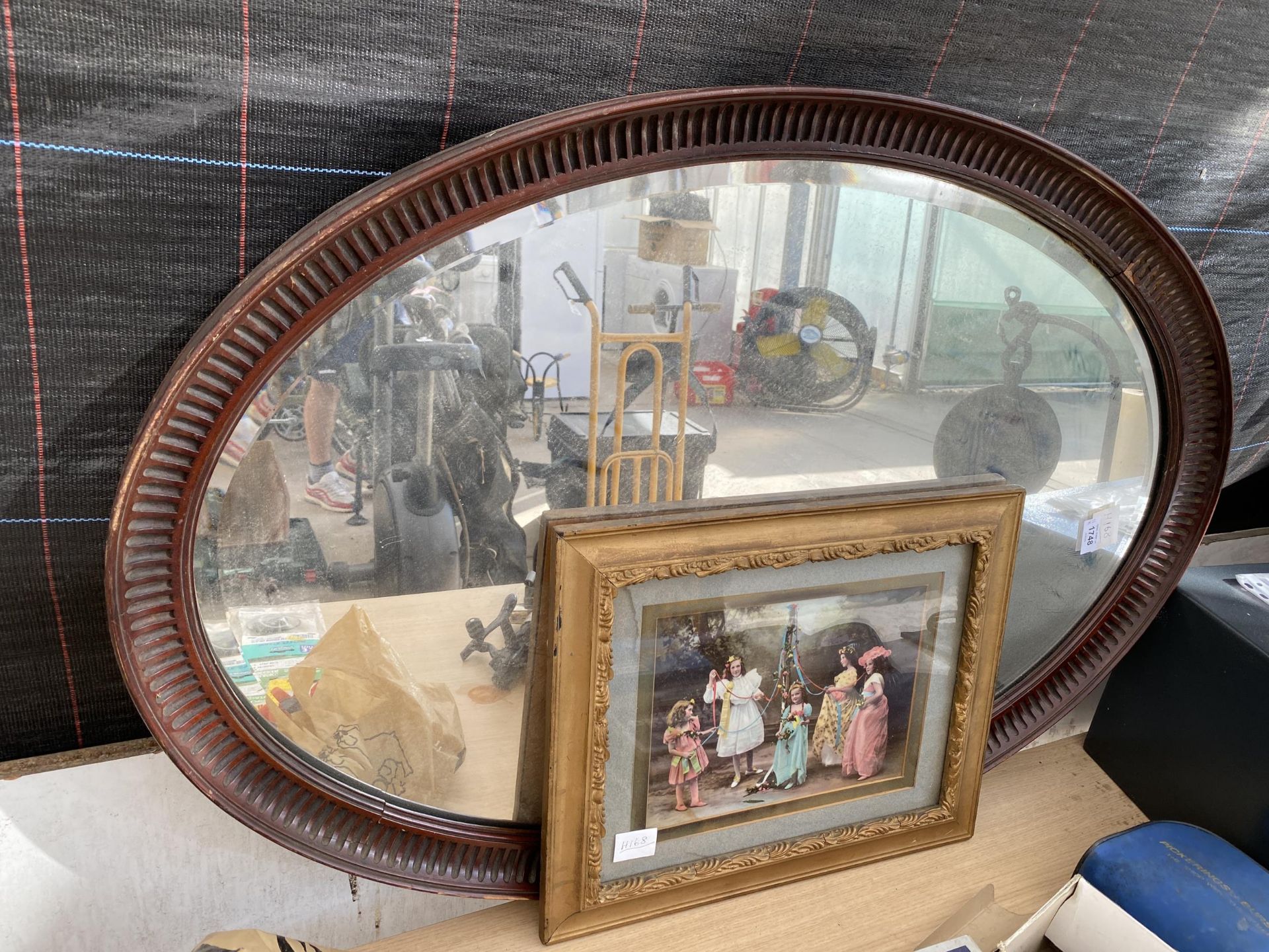 TWO ITEMS - WOODEN FRAMED OVAL MIRROR AND GILT FRAMED COLOUR PRINT