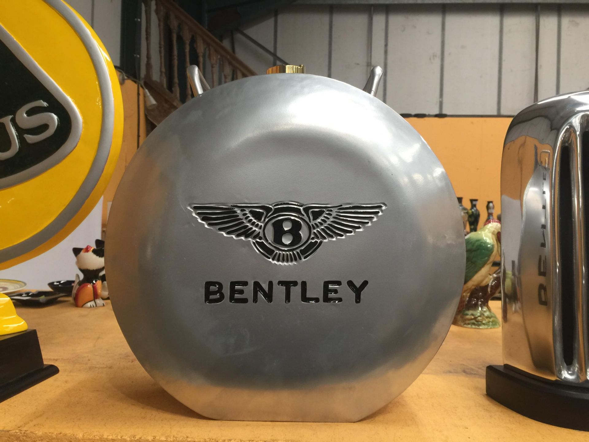 A CHROME BENTLEY PETROL CAN WITH BRASS TOP