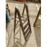 A VINTAGE SET OF STEP LADDERS