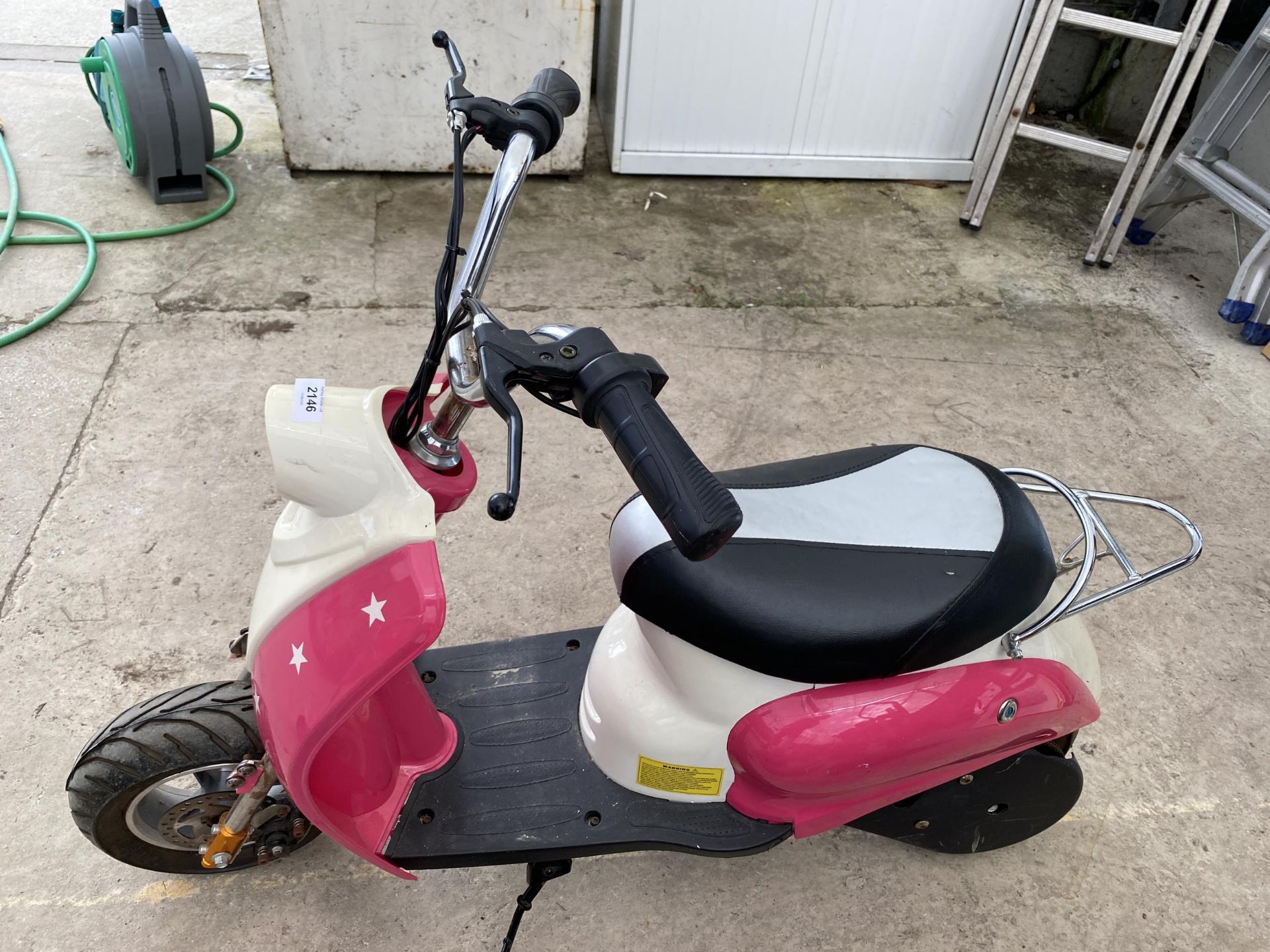 AN ELECTRIC CHILDS MOPED