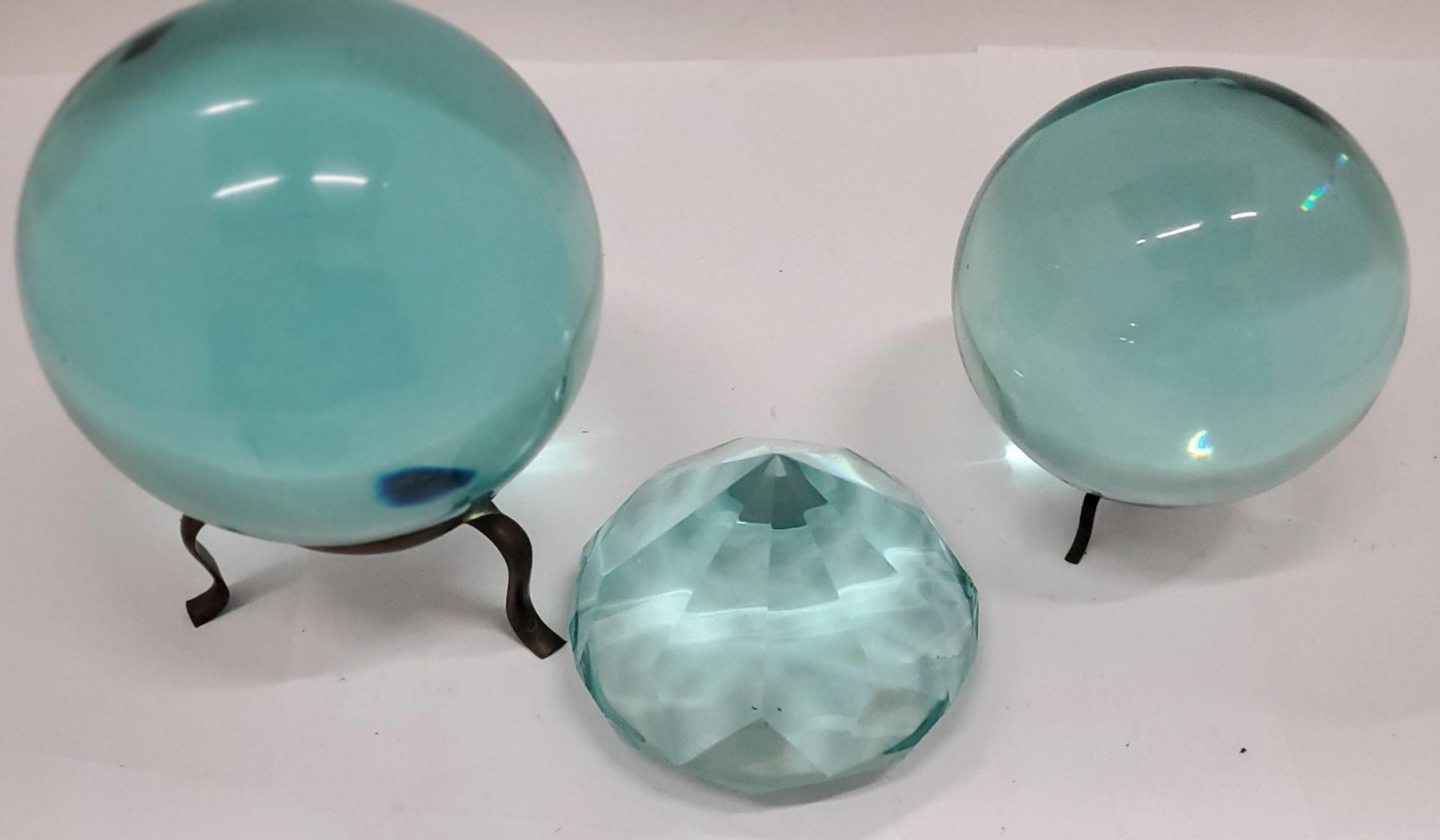 TWO TURQUOISE GLASS 'CRYSTAL BALLS' ON STANDS, A LARGE TURQUOISE CRYSTAL PLUS TWO PAPERWEIGHTS - Image 3 of 3