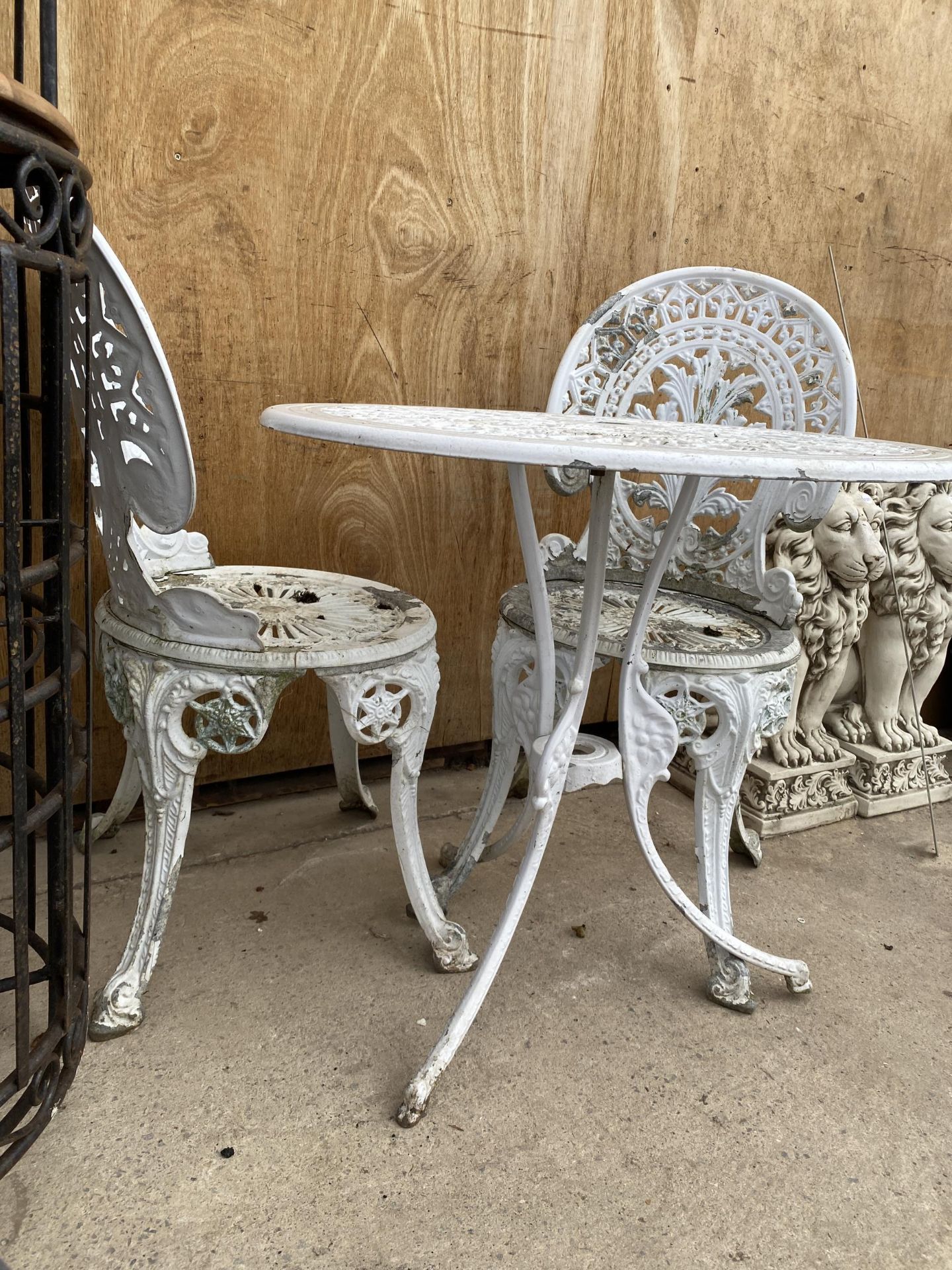 A VINTAGE CAST IRON METAL GARDEN BISTRO TABLE AND TWO CHAIRS - Image 2 of 2