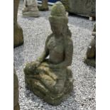 A LARGE RECONSTITUTED STONE BUDDHIST DIETY FIGURE - HEIGHT 104 CM, DEPTH 46 CM