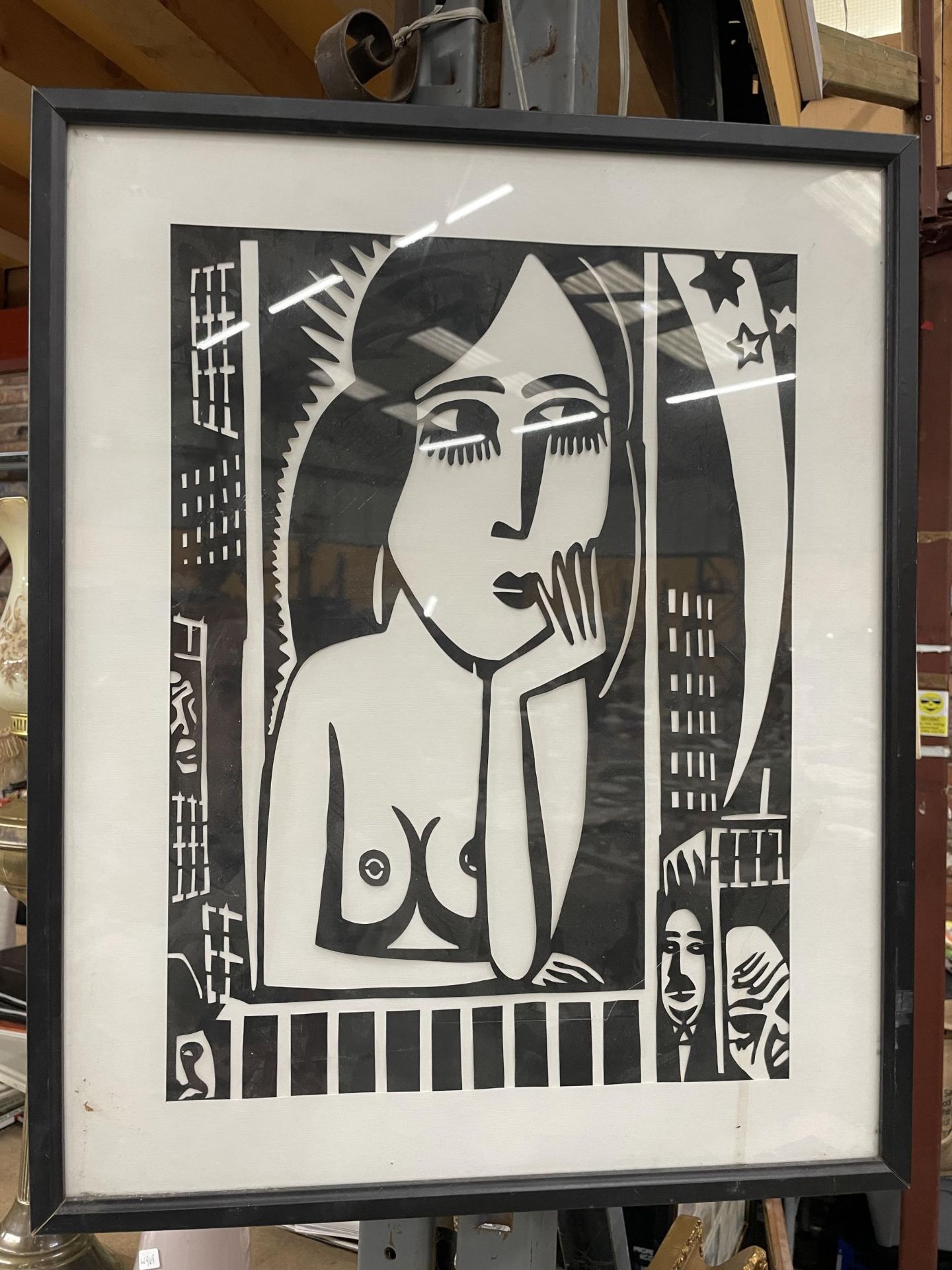 A FRAMED BLACK AND WHITE ABSTRACT NUDE PRINT
