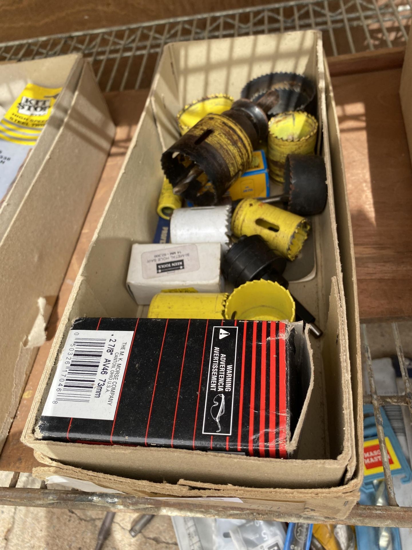 A BOX OF HOLE SAW TOOL ATTACHMENTS