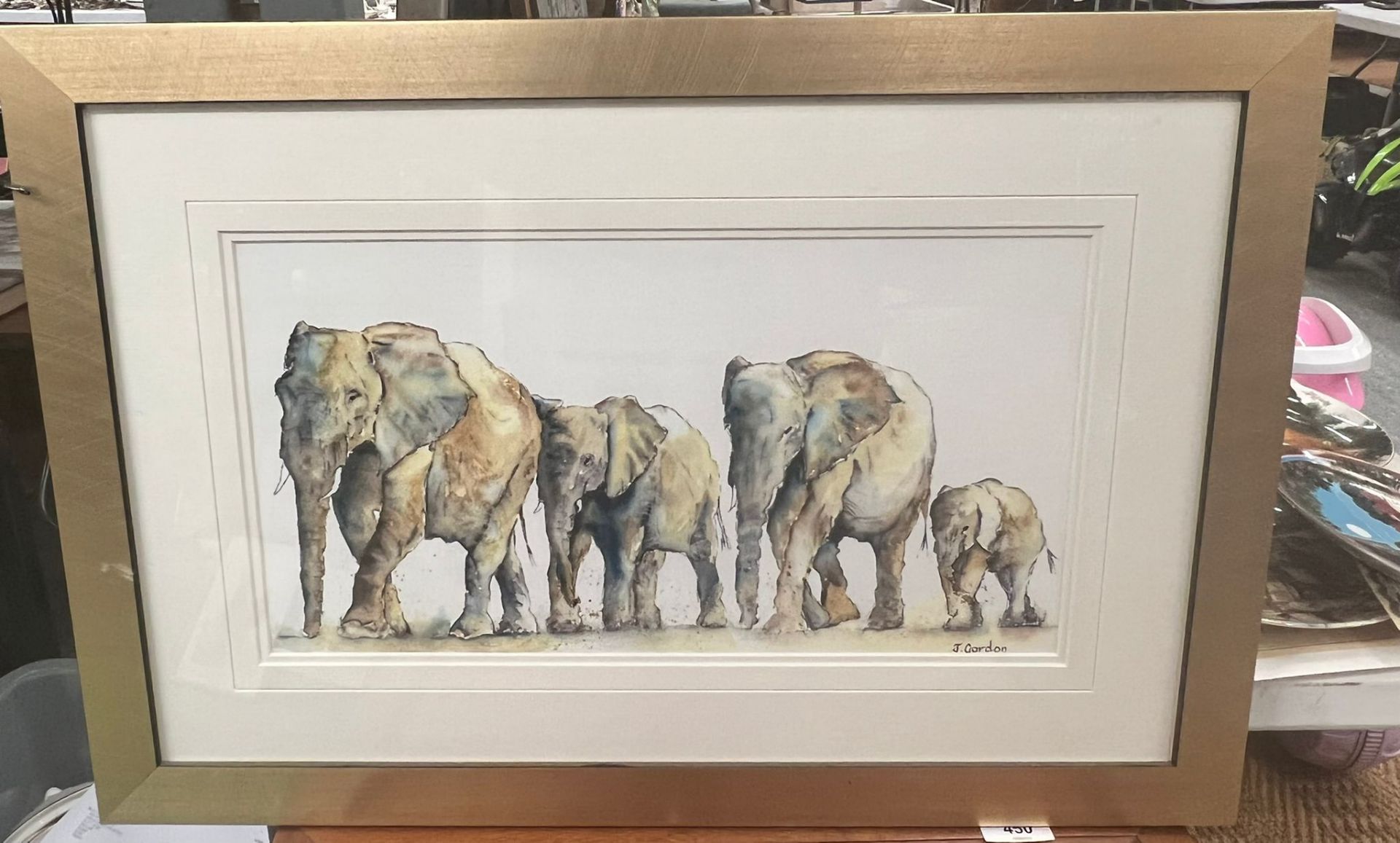 A FRAMED WATERCOLOUR OF A FAMILY OF ELEPHANTS, SIGNED J.GORDON