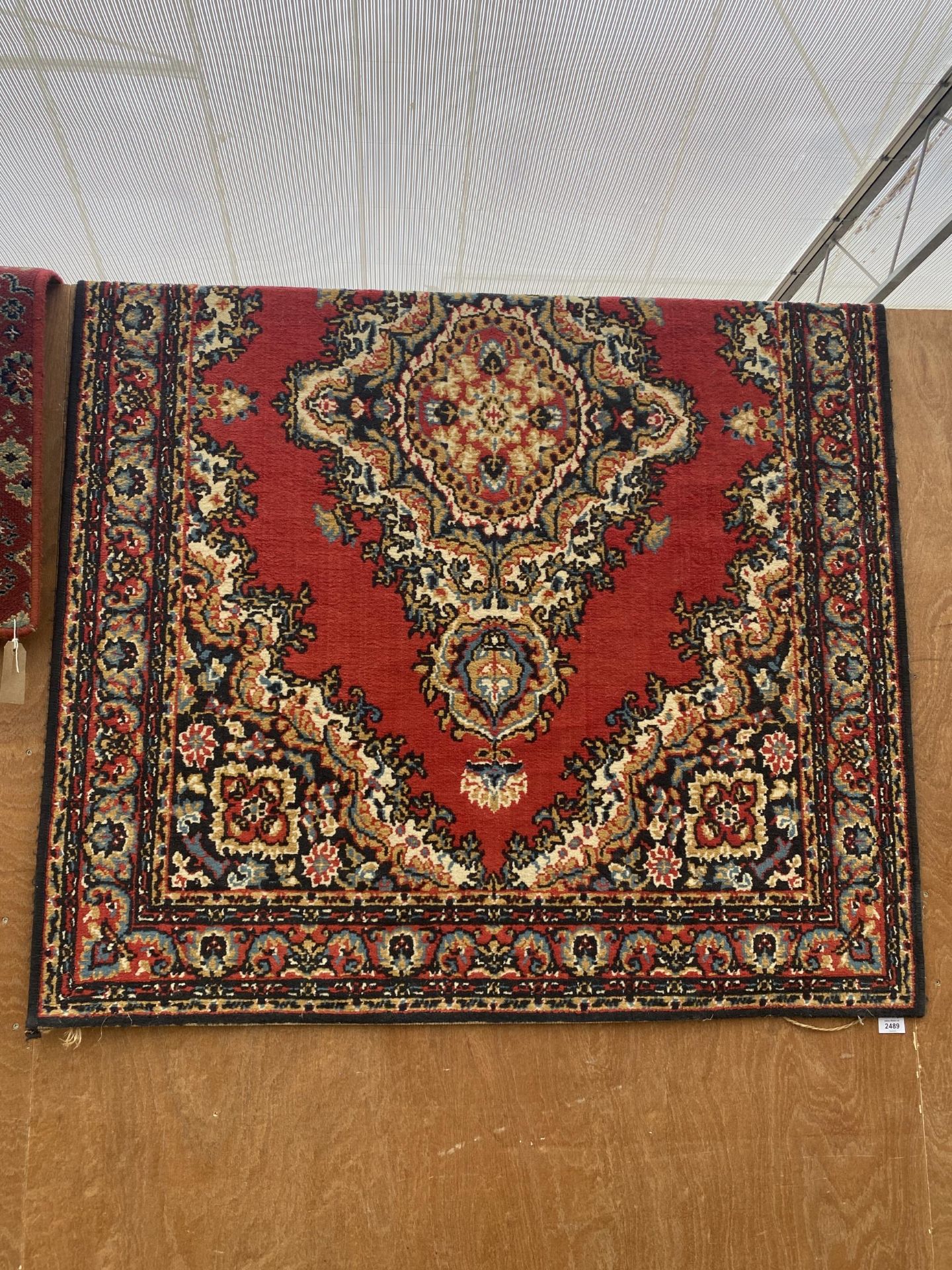 A RED PATTERNED RUG