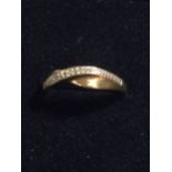 A 9CT GOLD CROSSOVER RING WITH DIAMONDS, WEIGHT 1.4G, SIZE J