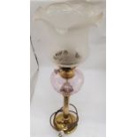 A LARGE TABLE LAMP IN THE STYLE OF A VINTAGE OIL LAMP, WITH BRASS STEM, FROSTED GLASS SHADE AND PINK