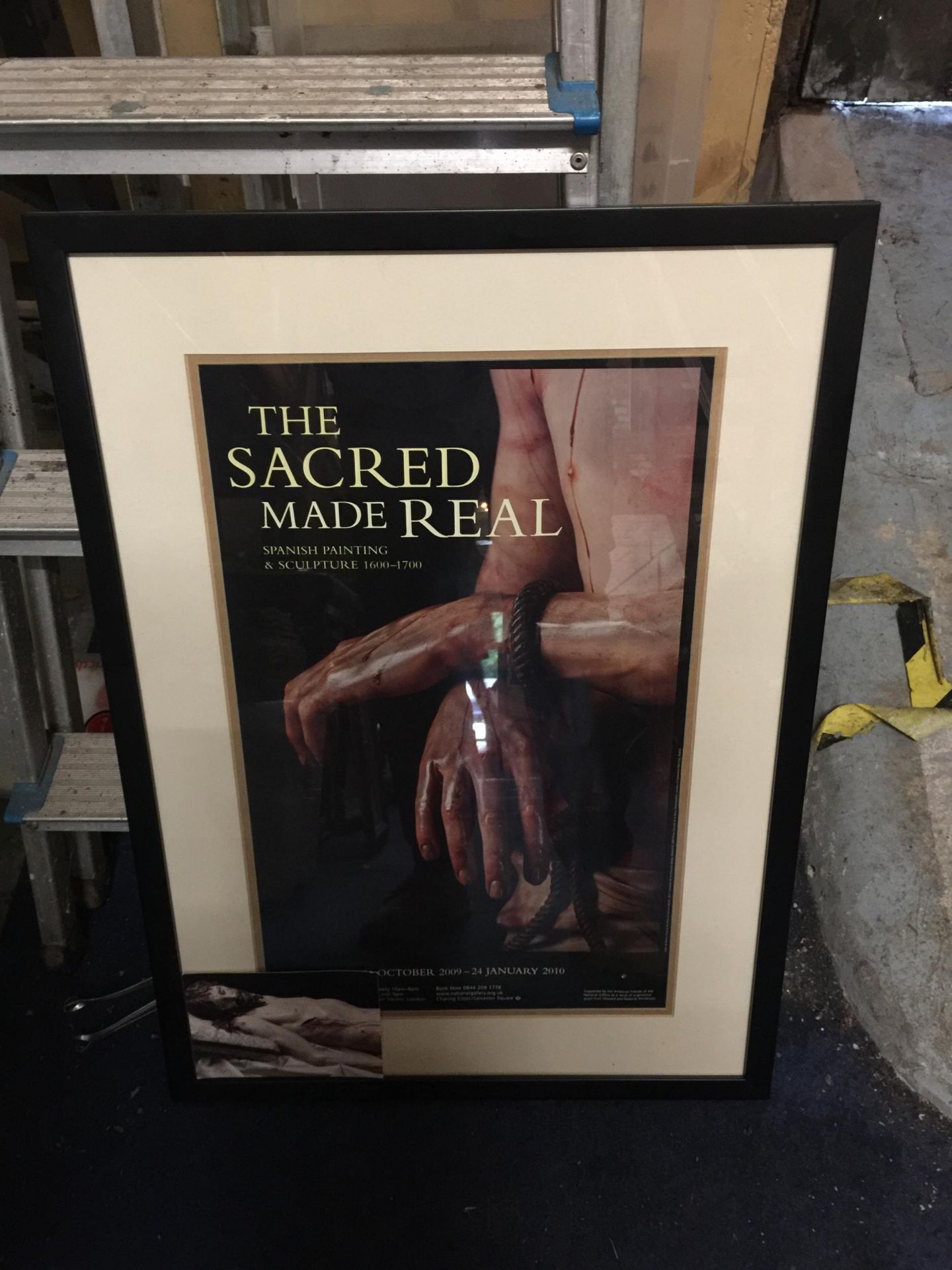 A FRAMED 'THE SACRED MADE REAL' SPANISH EXHIBITION POSTER