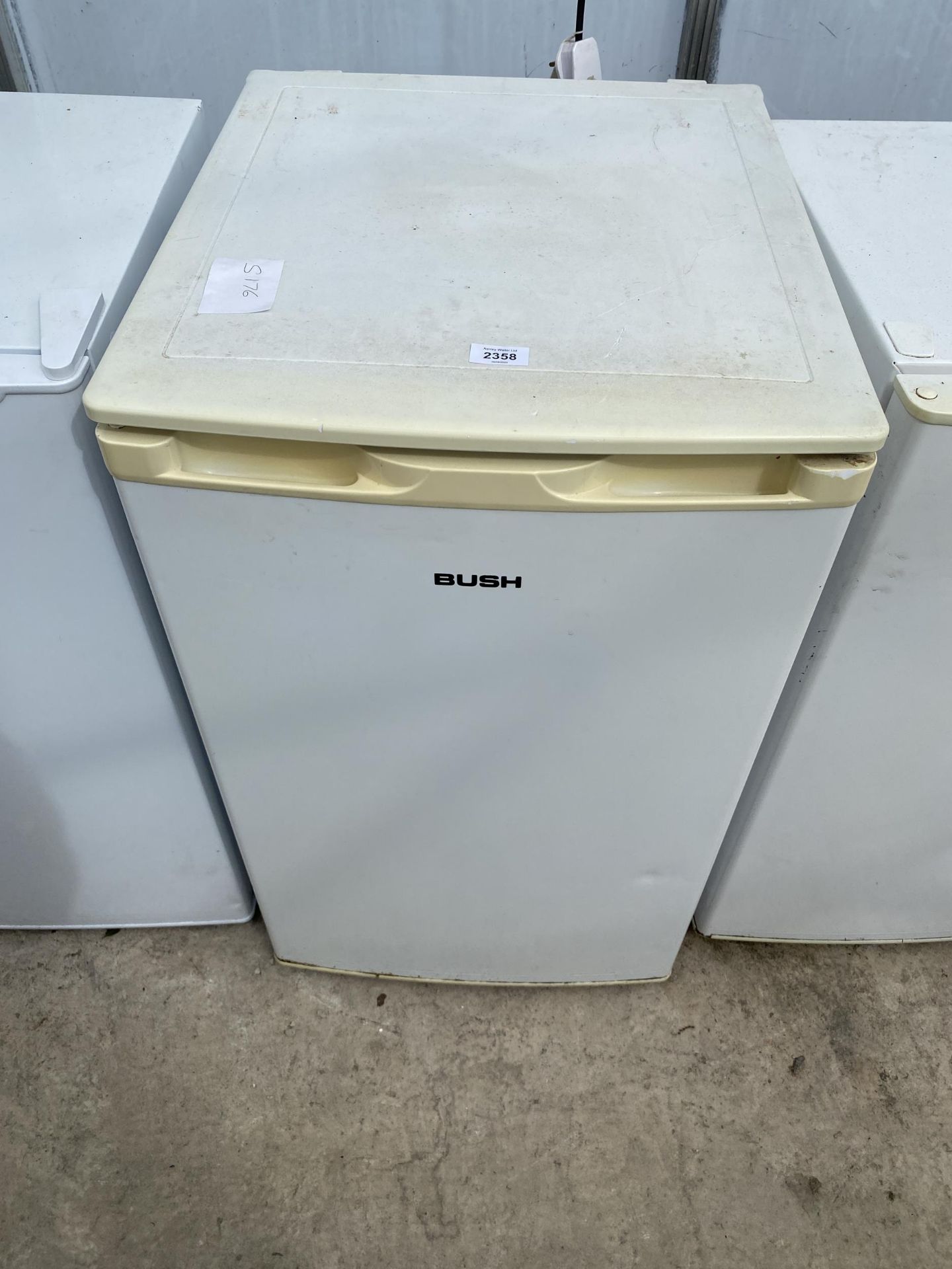 A WHITE BUSH UNDER COUNTER FRIDGE