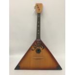 A VINTAGE WOODEN THREE STRING RUSSIAN BALALAIKA GUITAR