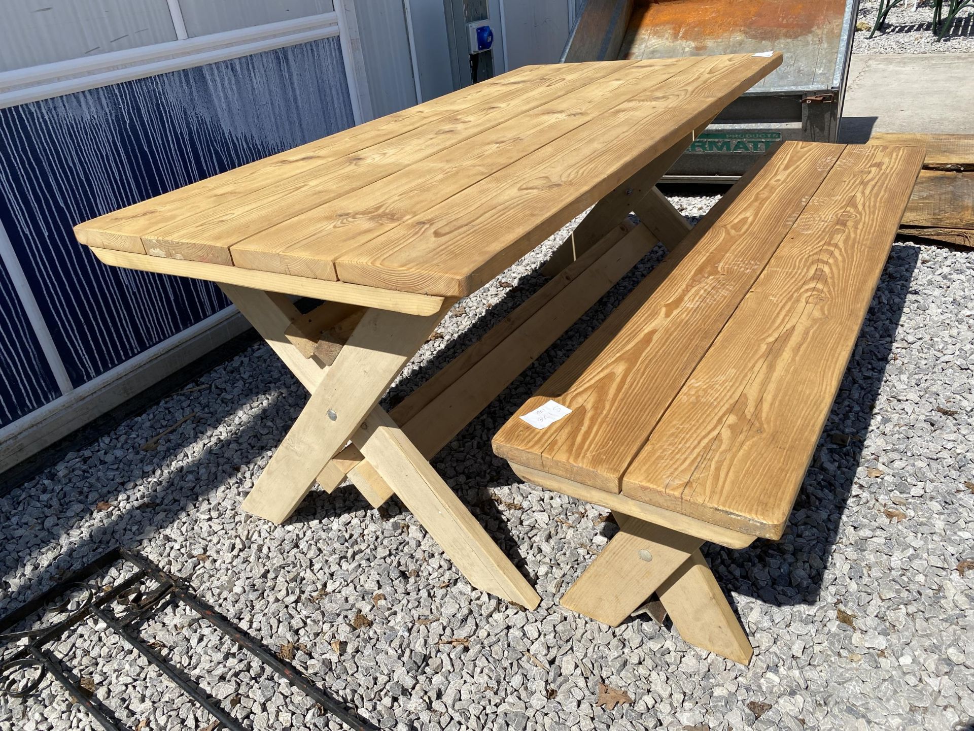 A HARDWOOD DINING TABLE AND BENCH