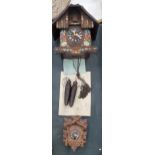 TWO SWISS STYLE WOODEN CUCKOO CLOCKS WITH WEIGHTS AND INSTRUCTIONS