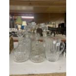 A COLLECTION OF CUT GLASS DECANTERS AND WATER JUG