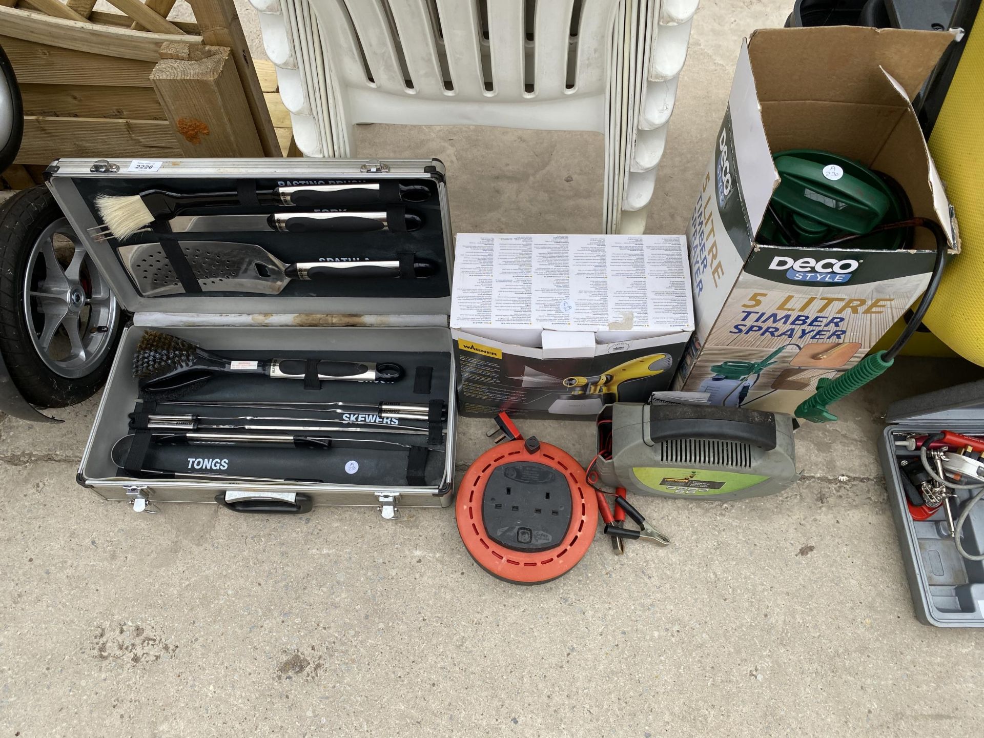 AN ASSORTMENT OF ITEMS TO INCLUDE A BBQ SET, EXTENSION LEADS, ETC