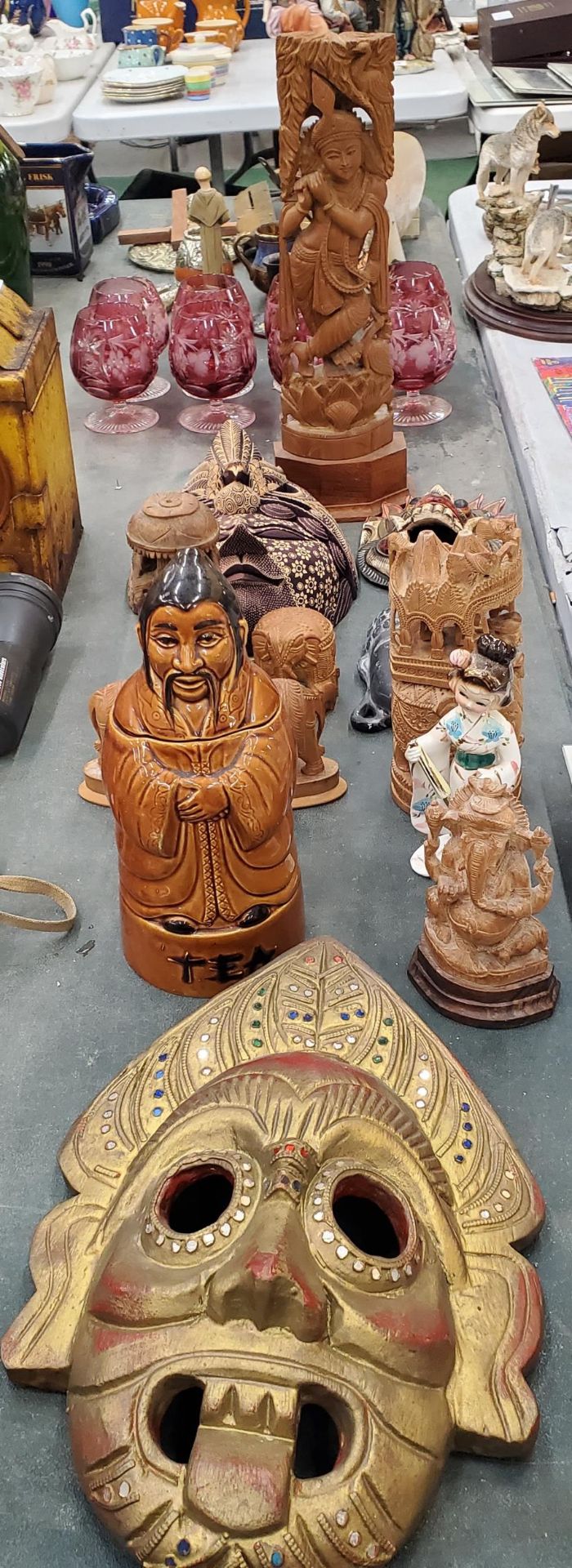 A QUANTITY OF TREEN ITEMS TO INCLUDE MASKS, ELEPHANTS, ASIAN STYLE, A PORCELAIN TEA CADDY, ETC